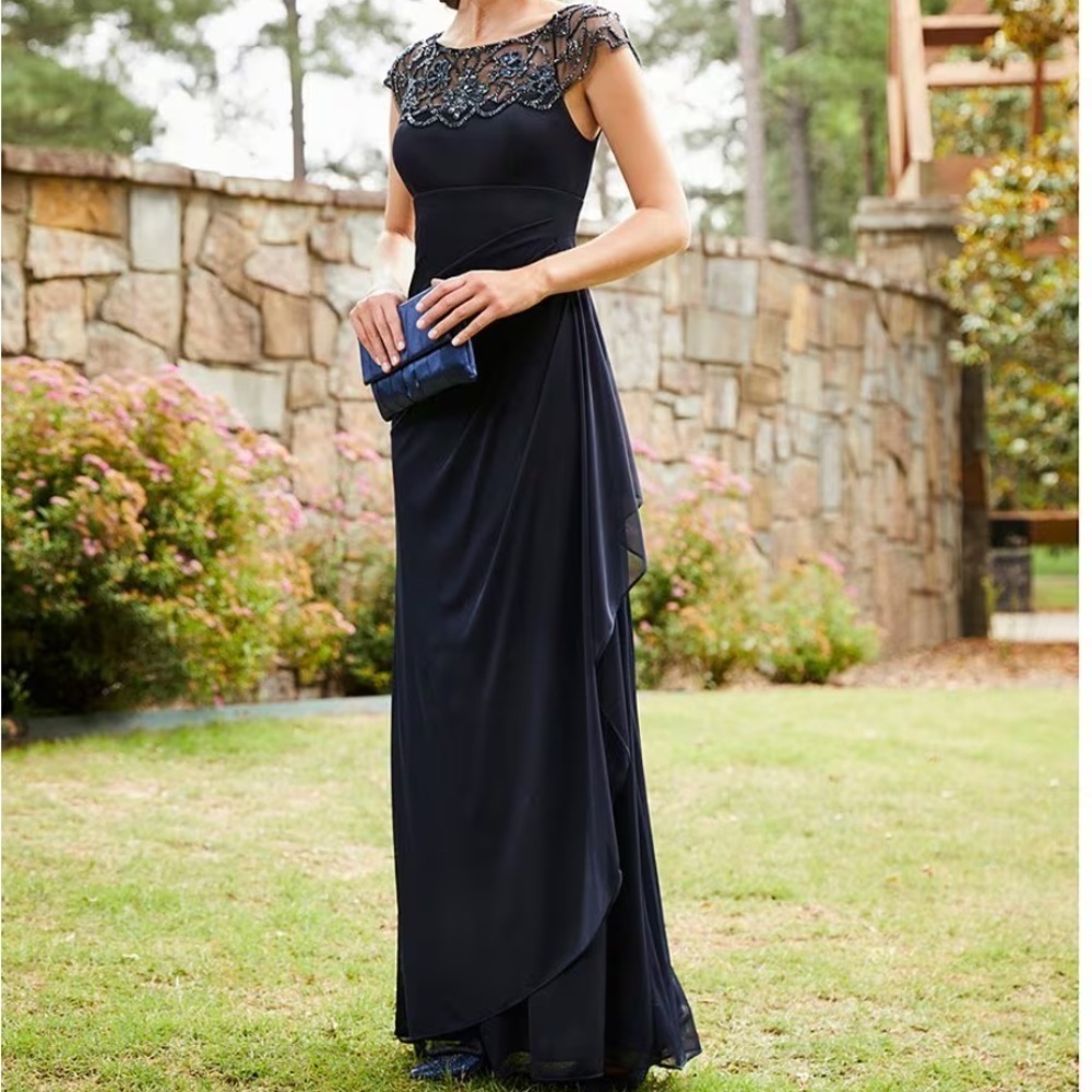 Xscape Beaded Yoke Cap Sleeve Round Neck Ruched Cascade Ruffle
Side Gown - Picture 2 of 12